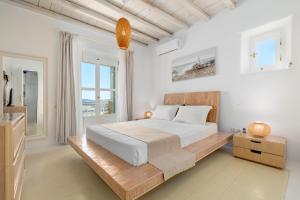 Ένα ή περισσότερα κρεβάτια σε δωμάτιο στο Thalasses Villas +115 φωτογραφίες