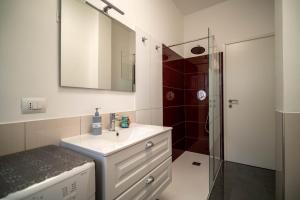 a bathroom with a sink and a shower at Casa Margherita in Vimercate +8 photos