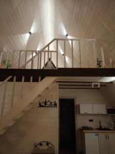 a wooden staircase in a room with a stair case at "Відпочинок в Карпатах" in Izki