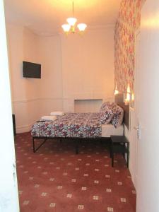 a bedroom with a bed in a room at Belroy Hotel in Blackpool +17 photos