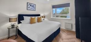 En eller flere senge i et værelse på Hybrid Resi - London, Mitcham close to Tooting and Wimbledon