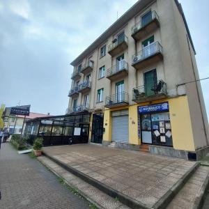 a building on a street next to a sidewalk at Case ieo - 200m da via Ripamonti Mi in Opera