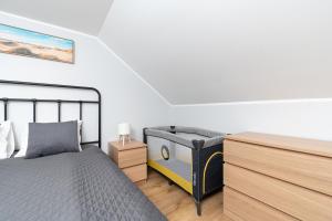 Postel nebo postele na pokoji v ubytování Kalma 7 Apartments