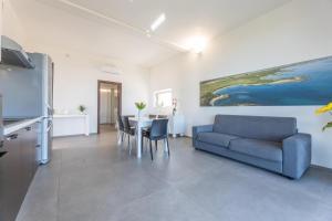 a living room with a couch and a table at Villa Alba Chiara in Serranova