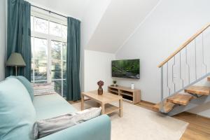 TV a/nebo společenská místnost v ubytování Kalma 7 Apartments