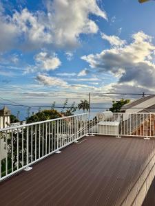 a balcony with a view of the ocean at Casa Neves in Arco da Calheta