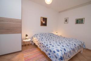 En eller flere senge i et værelse på Villa Branka