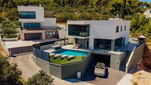 an aerial view of a house with a swimming pool at SEAPHORIA Luxury Modern Villa in Trogir