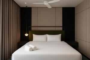 Postel nebo postele na pokoji v ubytování Antara Genting Premier Suites by Noble Nest + 18 fotografií