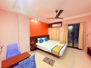 Postel nebo postele na pokoji v ubytování Bong Prince Near The New Digha Sea Beach