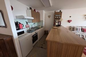 a small kitchen with a counter top in a room at Bruyères B22 in Verbier