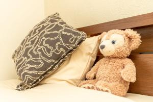 En eller flere senge i et værelse på BUDDY HOUSE - Newコスパ重視! サンタプレゼントパーク10分! カムイリンクス28分! コンビニ徒歩3分! 旭川鷹栖インター5分! 商業施設すぐ! + 42 billeder