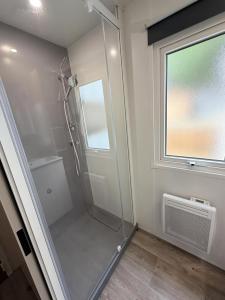 a walk in shower in a bathroom with a window at GK - Elégance & Confort, 3ch, 2sdb, piscine, plages et campagne in Lattes