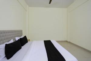 Ένα ή περισσότερα κρεβάτια σε δωμάτιο στο Hotel O Arena