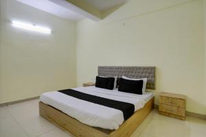 Ένα ή περισσότερα κρεβάτια σε δωμάτιο στο Hotel O Arena