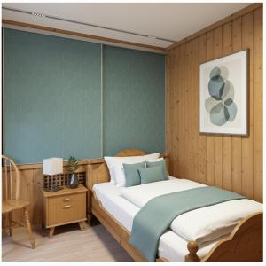 a bedroom with a bed with a blue accent wall at Hotel Sternen in Gurtnellen