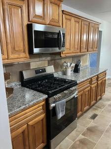 a kitchen with a stove and a microwave at Your special Stay in Birmingham