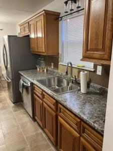 a kitchen with a sink and a refrigerator at Your special Stay in Birmingham