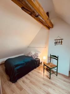 Ένα ή περισσότερα κρεβάτια σε δωμάτιο στο Le Nid de Chambord