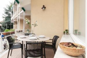 a table and chairs on the balcony of a building at Il Sogno a due passi dal mare vicino PORTOFINO in Rapallo