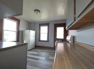 cocina con nevera blanca y encimera en S and K Properties, en Moline