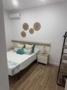 Кровать или кровати в номере Apartamento Bajo De Guía 1A