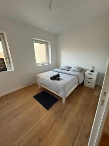 Postel nebo postele na pokoji v ubytování 2 Quai Charles Altorffer - 2E