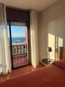 En eller flere senge i et værelse på Chalet cerca de Baiona con vistas al mar