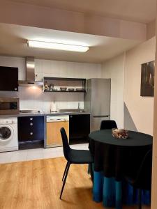 a kitchen with a table and chairs in a room at Estancia en Bernuy SEGOVIA VUT-40-808 in Bernúy de Porreros