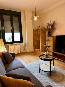 a living room with a couch and a table at Estancia en Bernuy SEGOVIA VUT-40-808 in Bernúy de Porreros