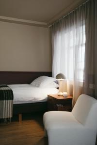 Ένα ή περισσότερα κρεβάτια σε δωμάτιο στο Aurora Farm Hotel