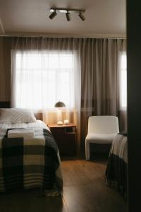 Postel nebo postele na pokoji v ubytování Aurora Farm Hotel