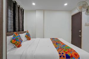 Ένα ή περισσότερα κρεβάτια σε δωμάτιο στο Via Ujwal Comforts