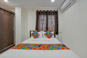 Ένα ή περισσότερα κρεβάτια σε δωμάτιο στο Via Ujwal Comforts