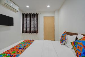 Ένα ή περισσότερα κρεβάτια σε δωμάτιο στο Via Ujwal Comforts