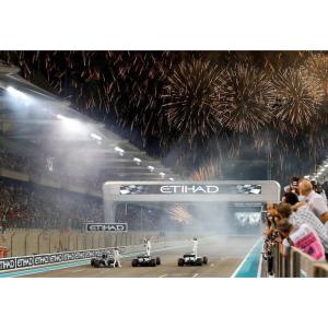 a picture of a race with fireworks in the background at Sapphire Haven - 1BR Apartment on Yas Island, near to Abu Dhabi Grand Prix in Abu Dhabi