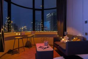 Et opholdsområde på Shanghai Hills&Sunflower Ultra Horizon Hotel & Suite