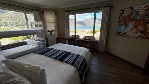 Postel nebo postele na pokoji v ubytování Dune Lodge