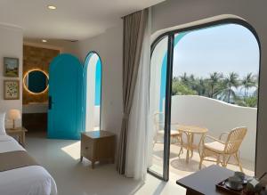 Un pat sau paturi într-o cameră la Homestay Santoni Mũi Né