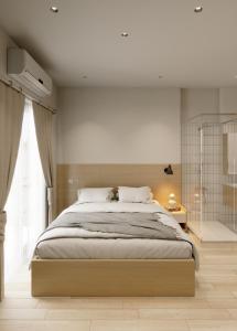 En eller flere senge i et værelse på La Cheminee Boutique Apartment