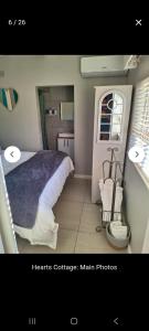En eller flere senge i et værelse på Heart's Cottage