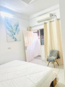 Ένα ή περισσότερα κρεβάτια σε δωμάτιο στο Residence Arielle