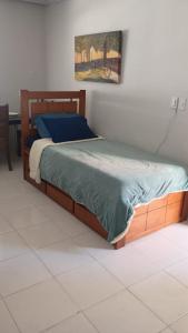 En eller flere senge i et værelse på Casa agradável no Rio de Janeiro - Ilha do Governador