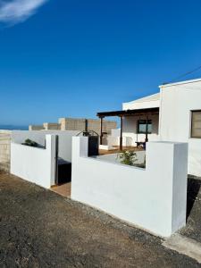 a white house with a view of the ocean at Villa Marée La Costa in La Costa