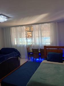 En eller flere senge i et værelse på Casa agradável no Rio de Janeiro - Ilha do Governador