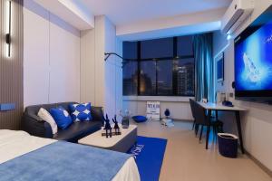 En eller flere senge i et værelse på Shanghai Hills&Sunflower Ultra Horizon Hotel & Suite