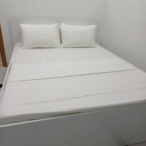 Ένα ή περισσότερα κρεβάτια σε δωμάτιο στο Saafu residents