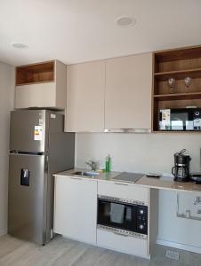 Η κουζίνα ή μικρή κουζίνα στο Loft a minutos del Shopping del Sol