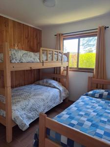 Postel nebo postele na pokoji v ubytování Cabañas Lefún