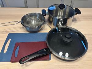 a frying pan sitting on top of a wooden table at とまるん桜山 in Nagoya